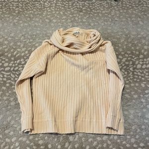 Cream sweater from these three boutique